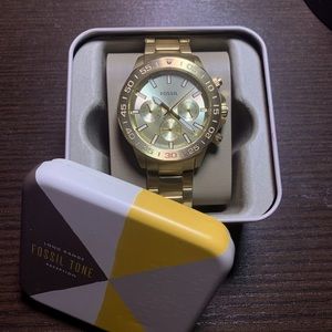 Gold Fossil watch, stainless-steal gold strap, multifunction.